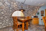 Unique rock walls add to the ambiance of this unique kitchen